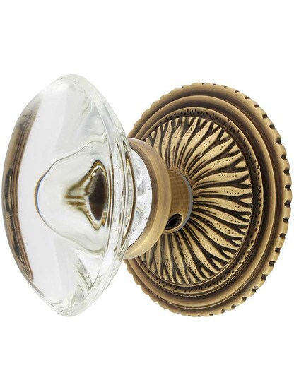 Sunburst Rosette Set With Oval Crystal Knobs in Antique Brass.